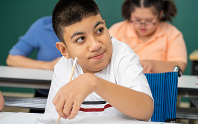 student with an alternate pencil